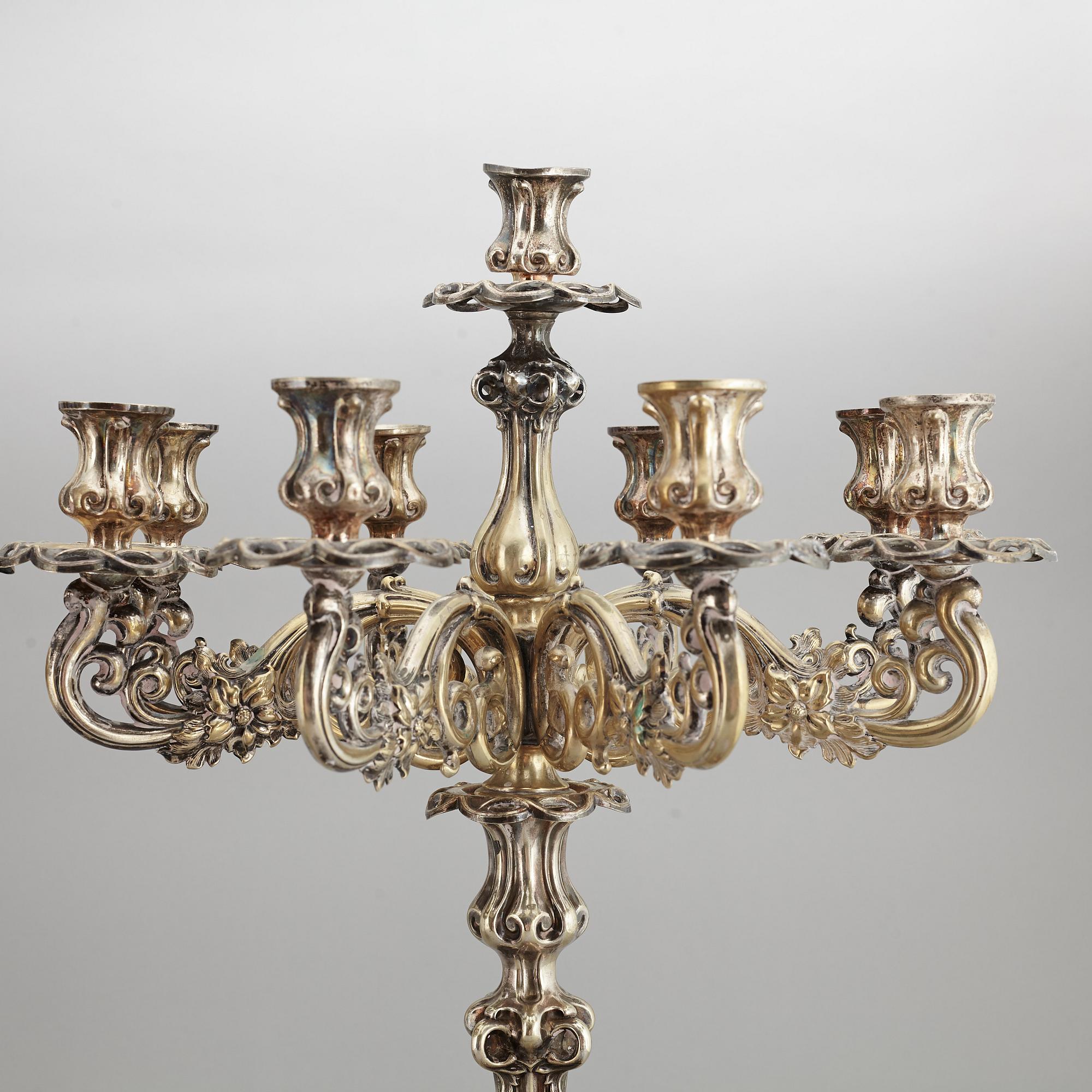 A pair of barocque style nine lights candelabra, silver plate, 20th Century.