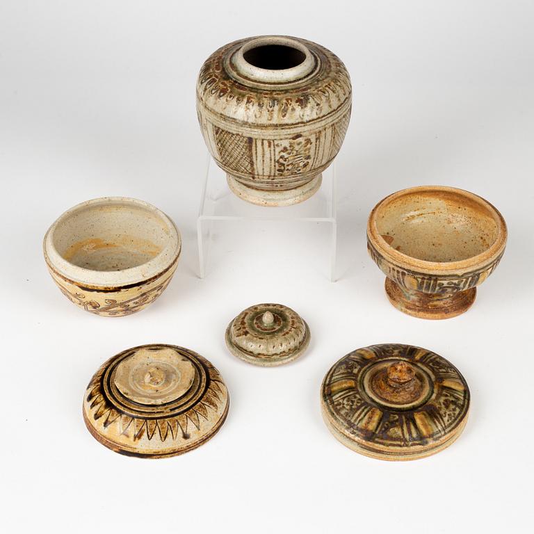 A group of three brown Sawankhalok jars with covers, Thailand, 14th/17th Century.