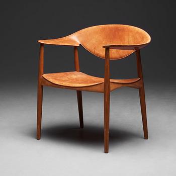 Aksel Bender Madsen & Ejner Larsen, a teak and leather "Metropolitan Chair", Willy Beck, Denmark 1950-60's.