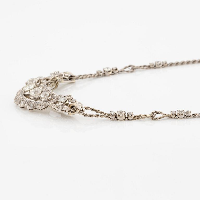 A brooch/necklace combination in 18K white gold set with old- and eight-cut diamonds.