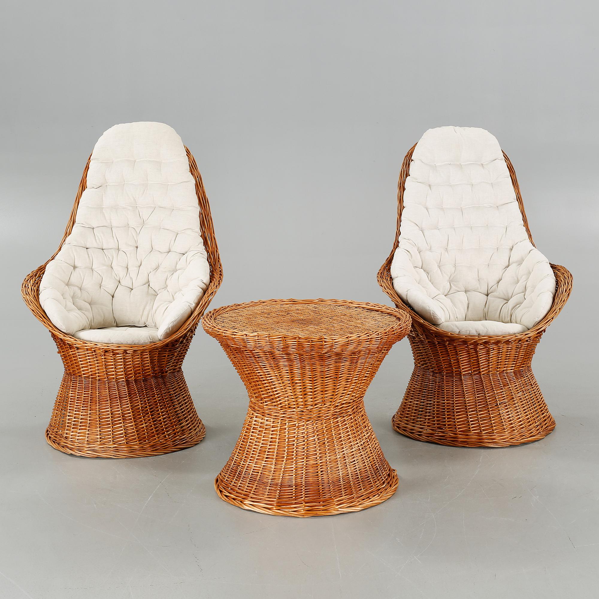 A pair of chairs and one table from the latter half of the 20th century.