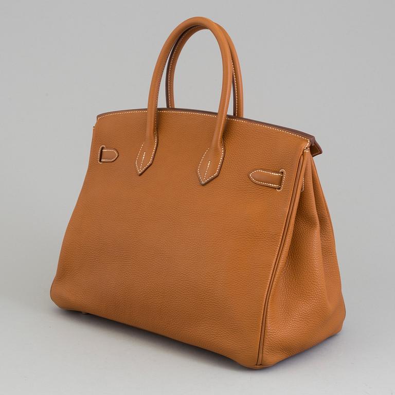 A gold togo Birkin 35 handbag by Hermès from 2004.