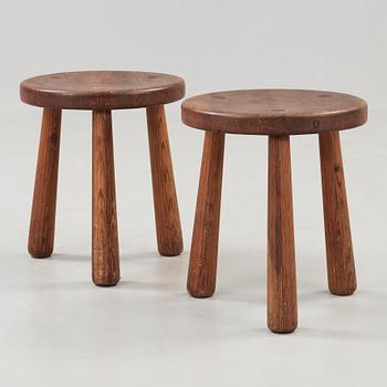 Axel Einar Hjorth, a pair of stained pine 'Utö' stools, Nordiska Kompaniet, Sweden ca 1930.