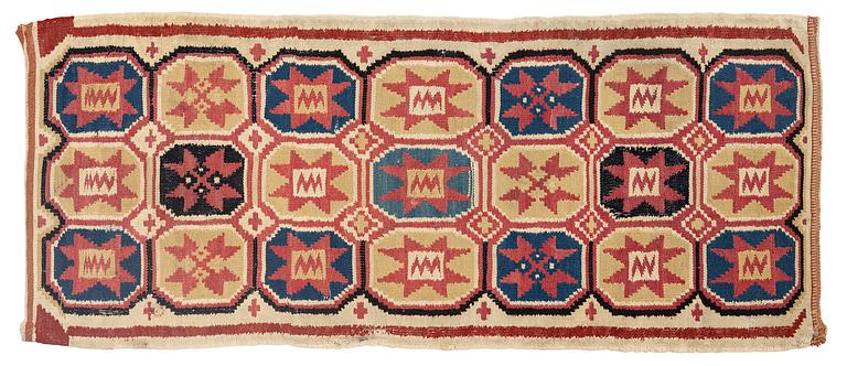 A carrige cushion, flat weave, c. 100 x 43 cm, Scania, 1790-1810.