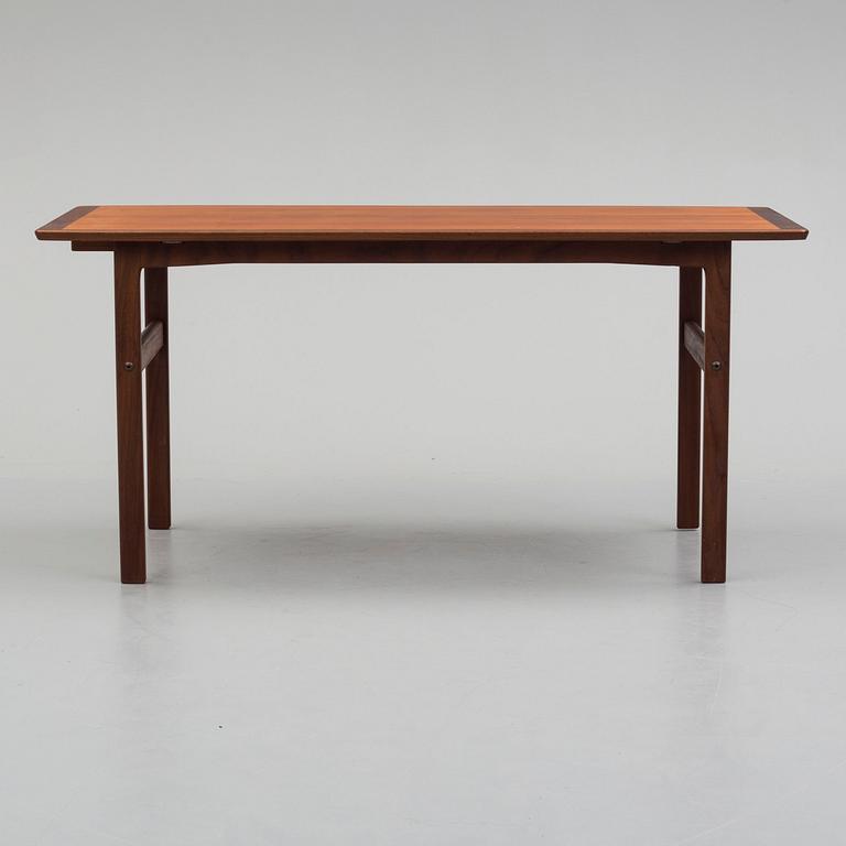 A second half of the 20th century teak vaneered coffee table.