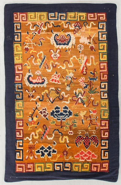 An antique Khaden Tibetan carpet ca 158 x 80 cm.