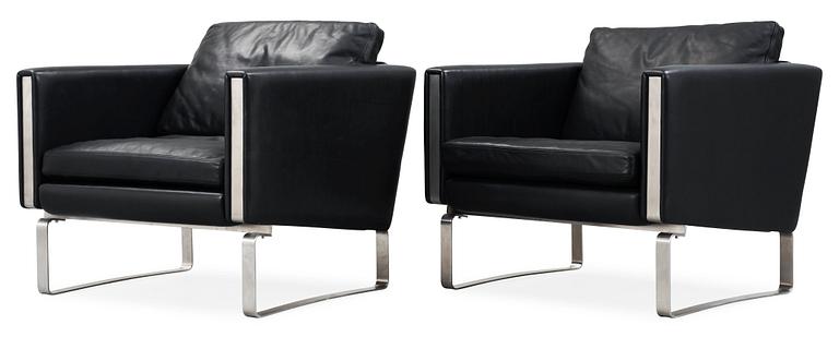 A pair of Hans J Wegner steel and black leather 'CH-101' easy chairs, Carl Hansen & Son, Denmark.
