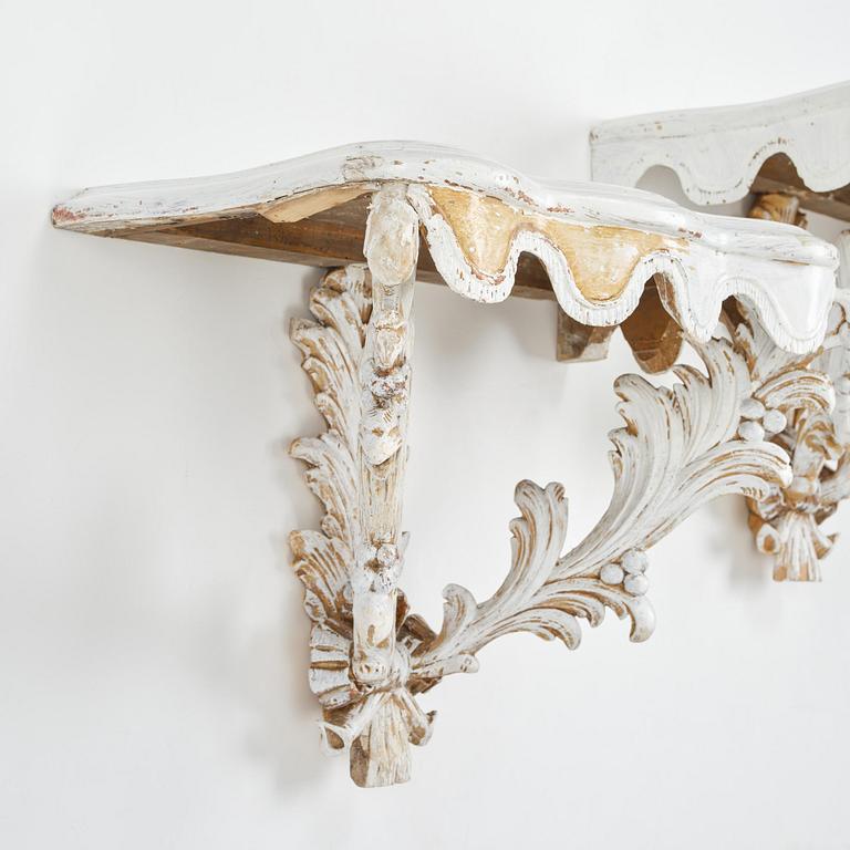 A pair of French Louis XVI-style consoles, late 19th century.