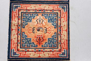 A semi antique chinese meditation rug, ca 159,5 x 57 cm.