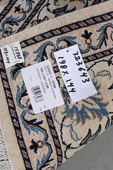 A rug, Nain, part silk, ca 198 x 144 cm.
