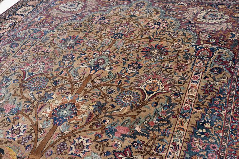 An antique/semi-antique Kerman carpet c 415 x 305 cm.