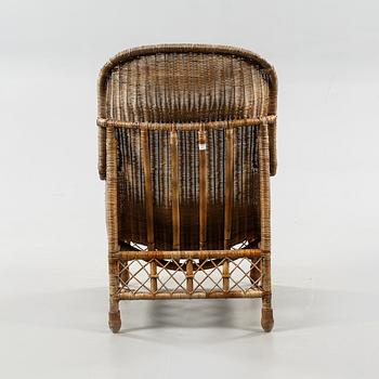 A rattan arm chair from the second half of the 20th century.