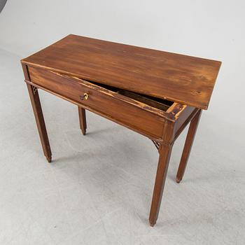 In the manner of the artist, a early 19th century late Gustavian table veneered with mahogany.