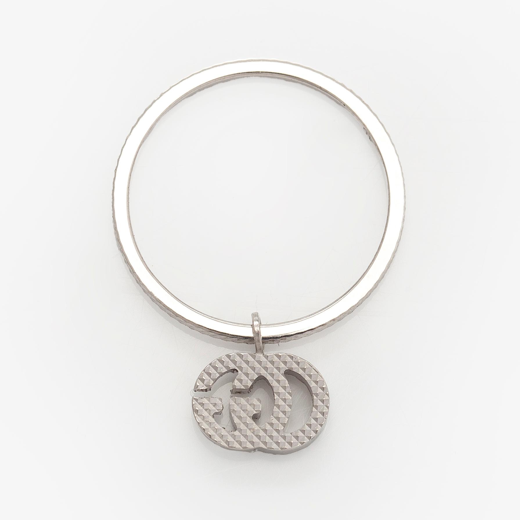 Gucci, sormus, "GG Running Charm", 18K valkokultaa ja timantteja.