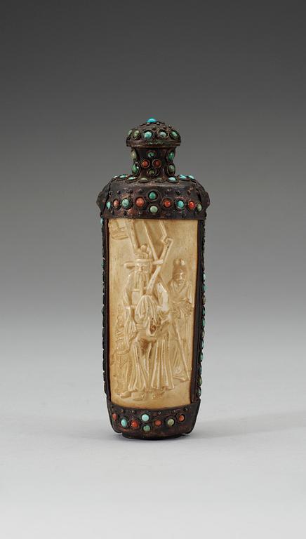 A turquoise inlayed metal framed ivory flask, late Qing dynasty (1644-1911).