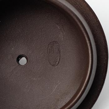 Two yixing teapots, China, 1980s and 2000.