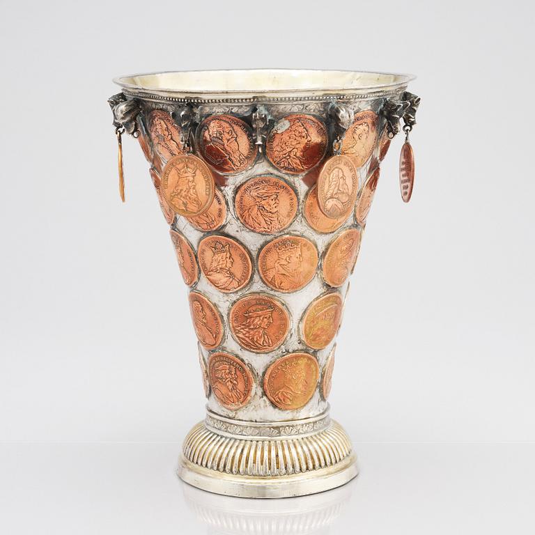 A Swedish 18th century parcel-gilt silver coin-beaker.