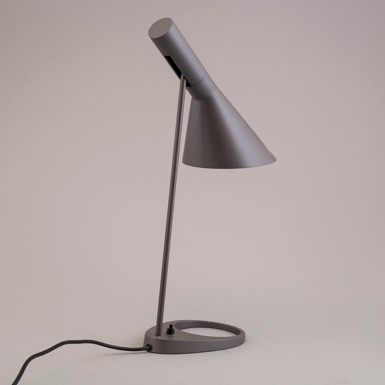 An Arne Jacobsen "AJ" table lamp.