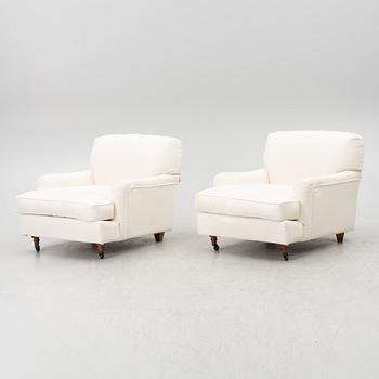 Vico Magistretti, a pair of 'Raffles' armchairs, De Padova, Italy, 21st century.