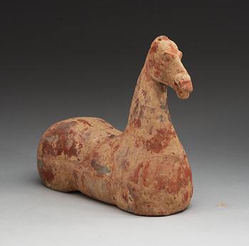 A pottery figure of a horse, Han dynasty (206 BC - 220 AD).