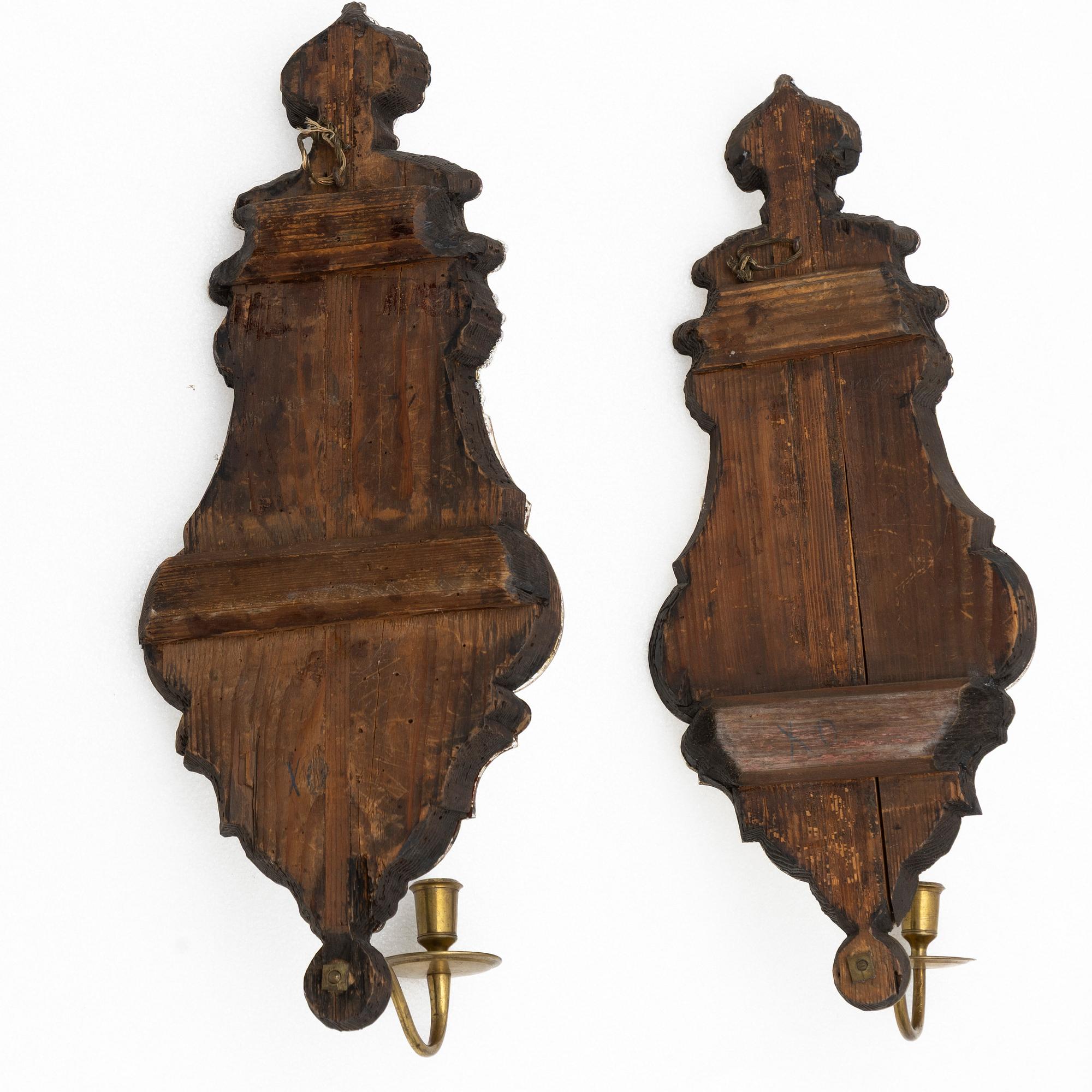 A pair of Nort European late baroque one-light girandole mirrors, mid 18th century.