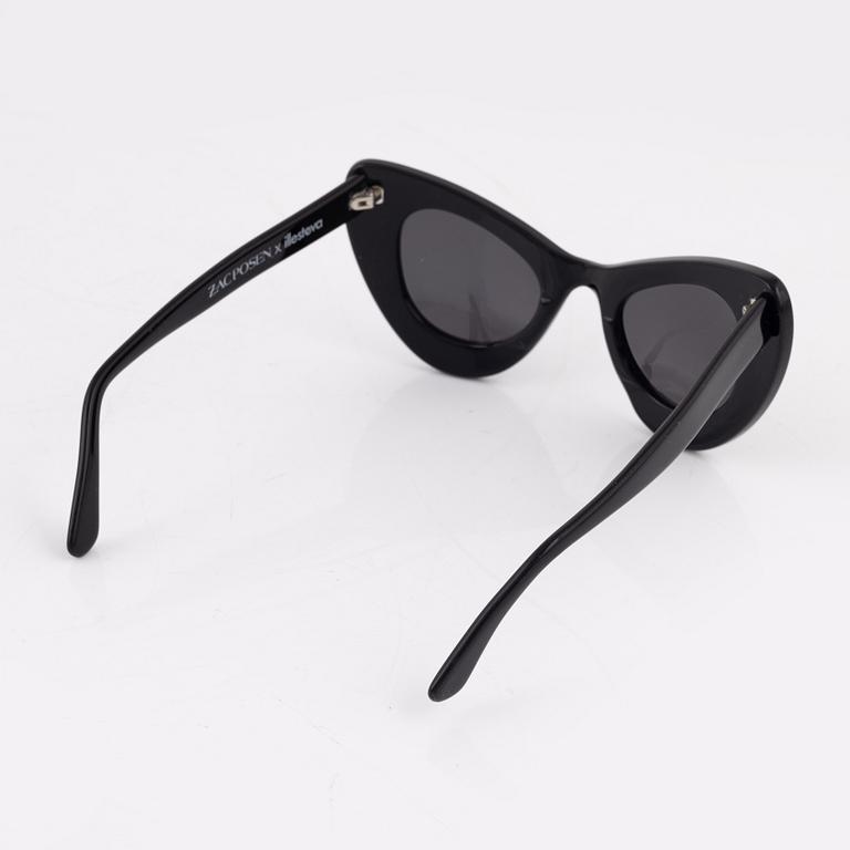 Illesteva, a pair of black "Zac posen x Illesteva" sunglasses.