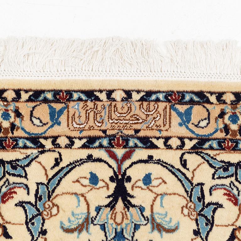 A carpet, Nain, part silk, fine 9 laa, signed, ca 327 x 210 cm.