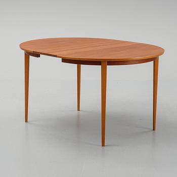 A teak dining table with 4 'Monaco' chairs, mid 20th century.