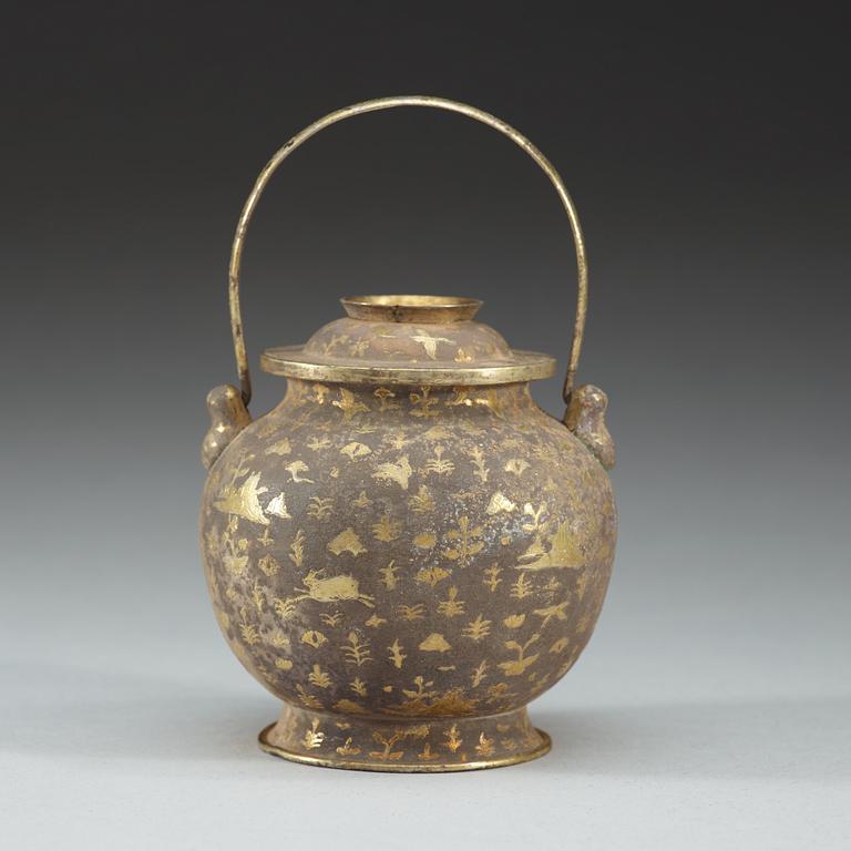 A gilt silver jar with cover and handle, presumably Tang dynasty.