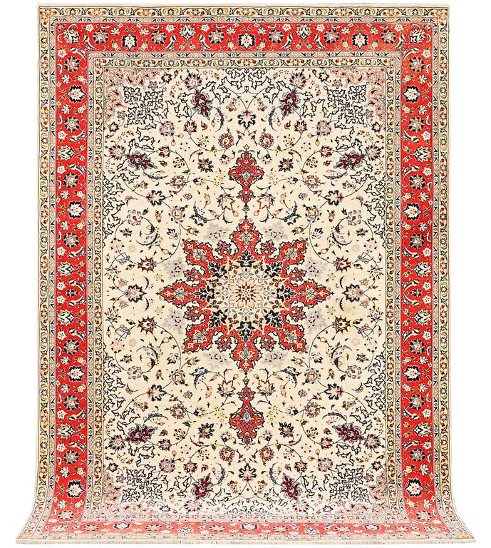 A Tabriz, part silk carpet, c. 300 x 199 cm.