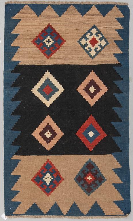 A RUG, possibly a Veramin kilim, ca 173,5 x 102,5 cm.