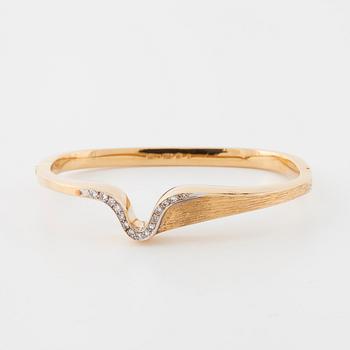 A single cut diamond bangle.