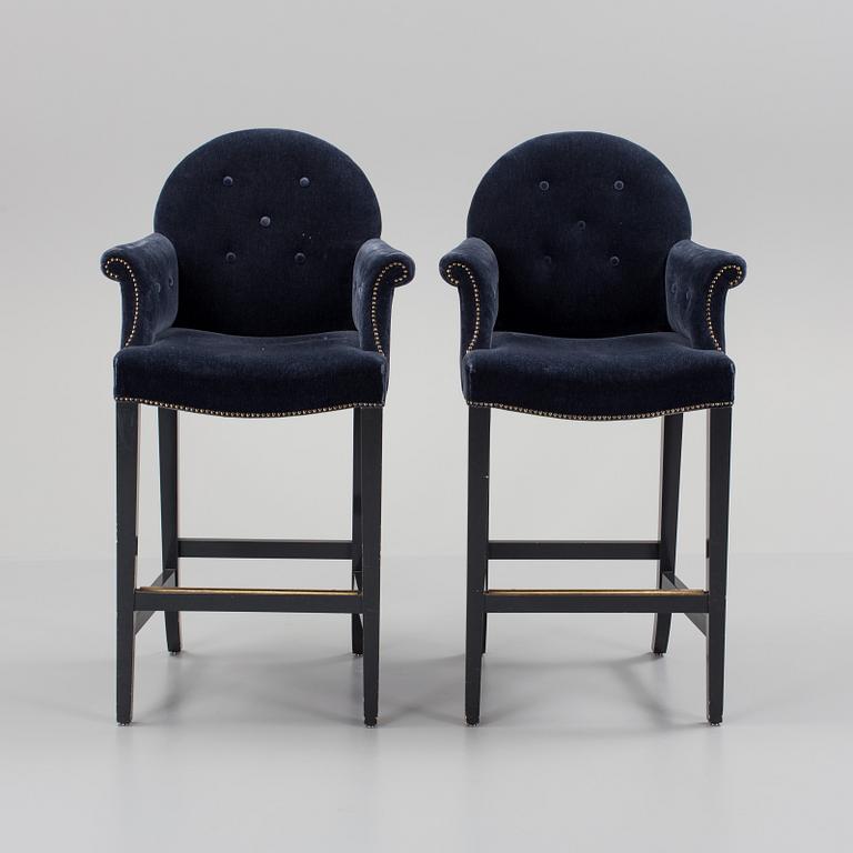 A pair of "The Simplified Moonback Counter Height Stool" barstools by Soane Britain.