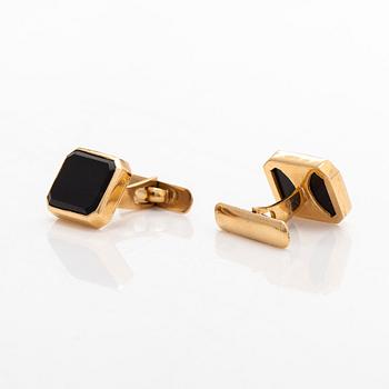 A pair of cufflinks and three shirt buttons,  18K gold and onyx.
