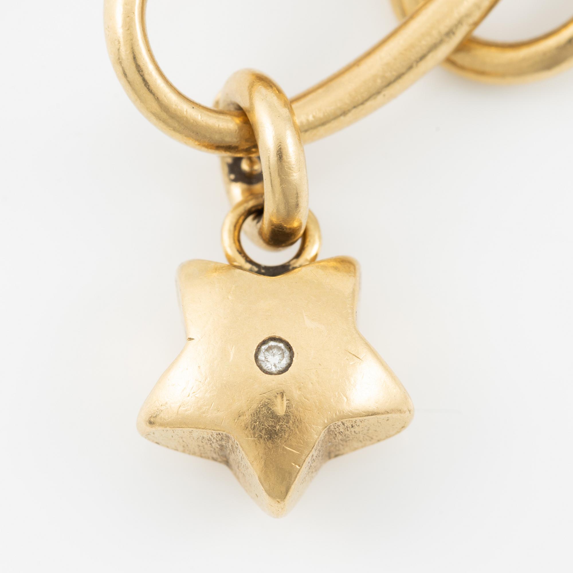 Charlotte Lynggaard, Ole Lynggaard, armband, 18K guld med berlocker i form av elefant, stjärna och hjärta.