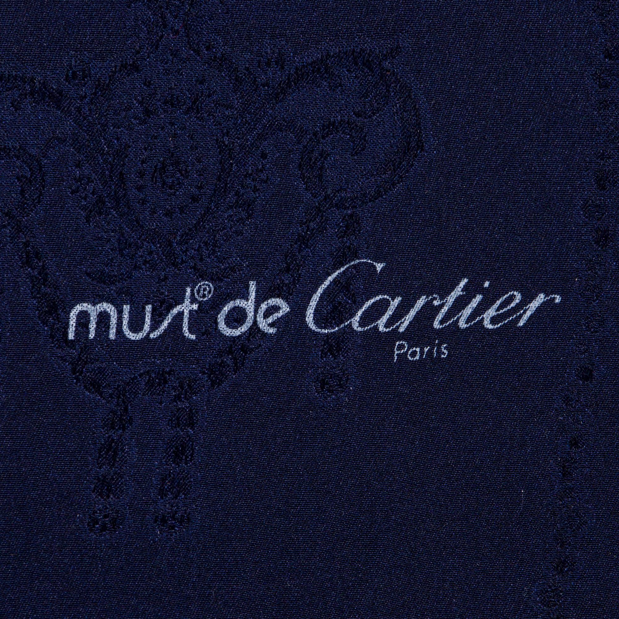 must de Cartier, a silk scarf.