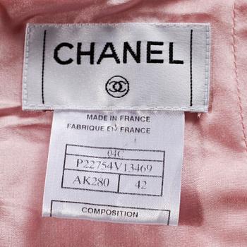 A pink bouclé skirt by Chanel.