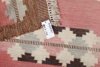 A flat weave carpet, signed GG, c. 190 x 133 cm.