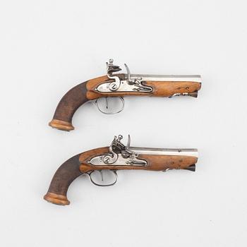 Flintlock pistols, a pair, France, early 19th century.