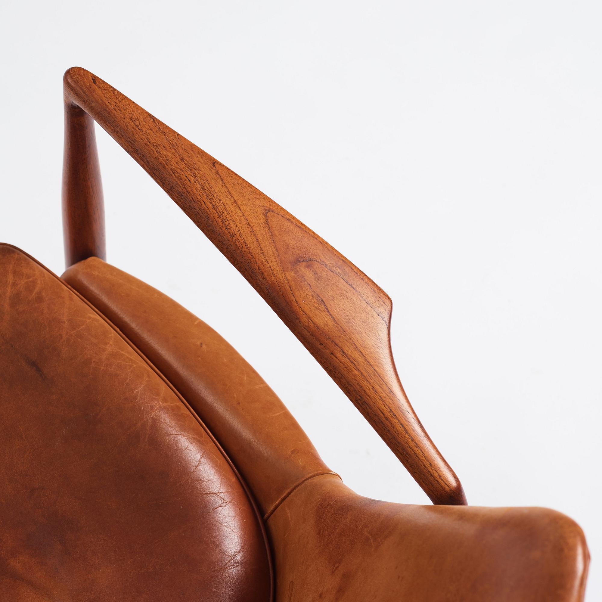 Ib Kofod-Larsen, a teak and cognac coloured leather 'Sälen' easy chair, Olof Perssons Fåtöljindustri (OPE), Sweden, 1950-60s.