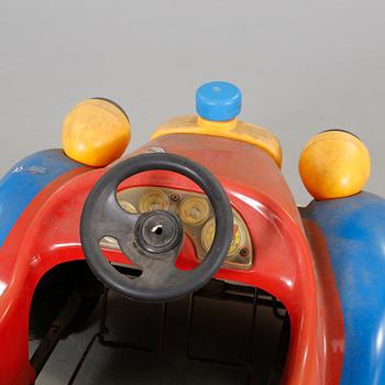 A pedal car from the latter half of the 20th century.