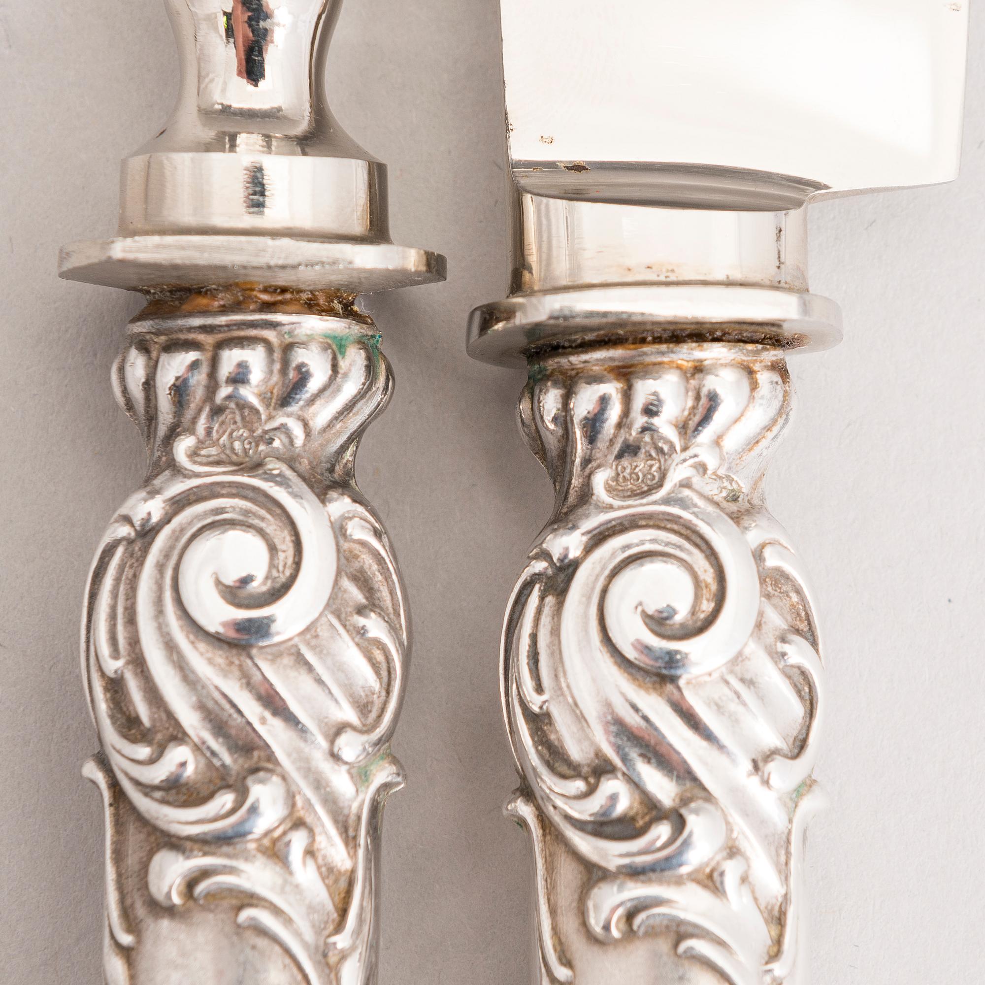 Silver serving cutlery, three with mark of Ferdinand Timper, Helsinki 1901-02 and a pair with German marks, ca. 1900.