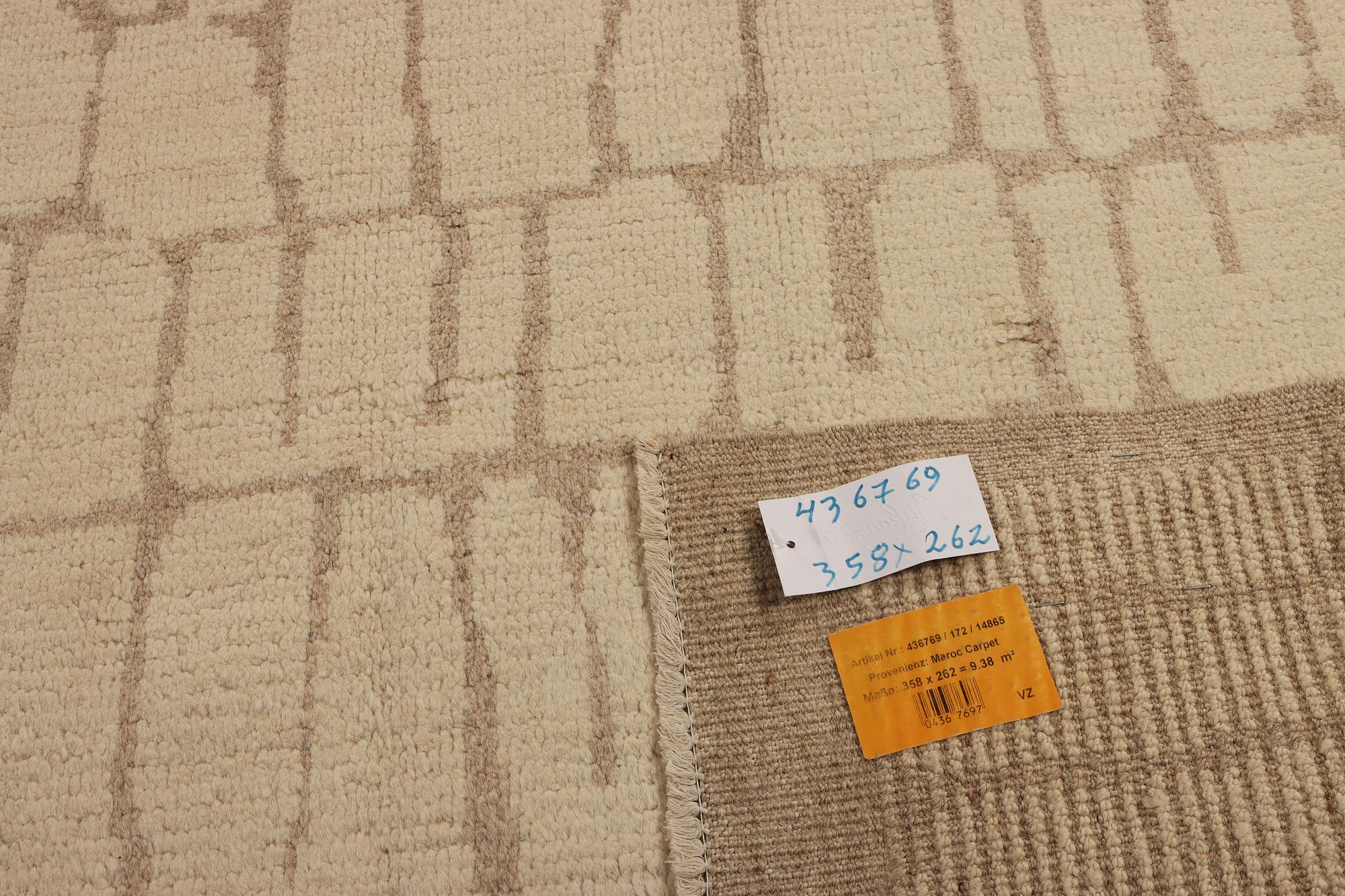 A Moroccan carpet, c. 358 x 262 cm.