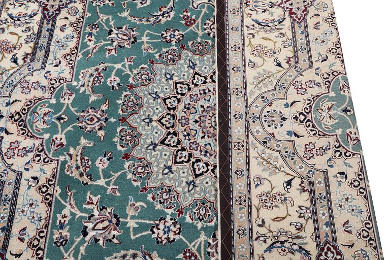 A Nain carpet, part silk, 6 laa, c. 300 x 201 cm.