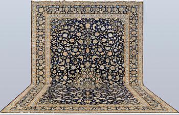 A Keshan carpet, signed, approx. 600 x 400 cm.