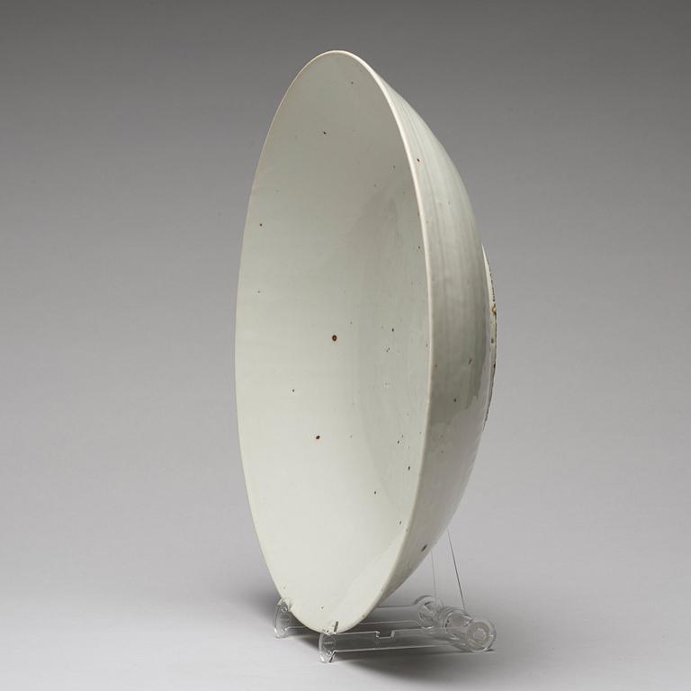 A large white glazed Swatow dish, Ming dynasty (1368-1644).