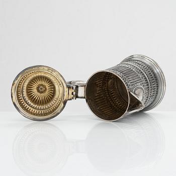 A sterling silver jug, London, unidentified marks.