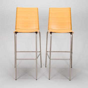A pair of "Millefoglie" bar stools from Biagio Cisotti and Sandra Laube for Plank.