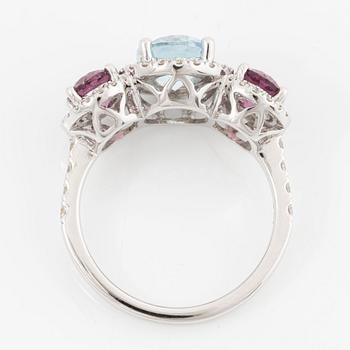 Ring in 18K white gold with blue topaz, rhodolite garnet, and brilliant-cut diamonds.