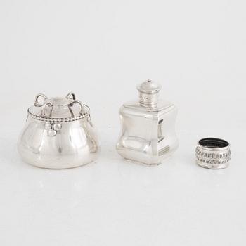 A silver tea caddy, a sugarbowl and a napkin ring, including K. Anderson, Stockholm 1920.